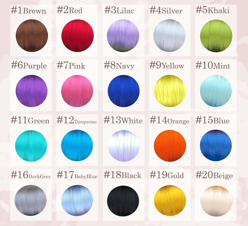 May include: A color chart featuring twenty numbered circular swatches of thread. The colors include brown, red, lilac, silver, khaki, purple, pink, navy, yellow, mint, green, turquoise, white, orange, blue, dark grey, baby blue, black, gold, and beige.