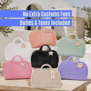 May include: A collection of seven jelly-style handbags in white, peach, black, mint green, pink, beige, and lavender. Each bag features a textured, grid-like pattern, two top handles, and a small wooden tag attached to the front with a name.
