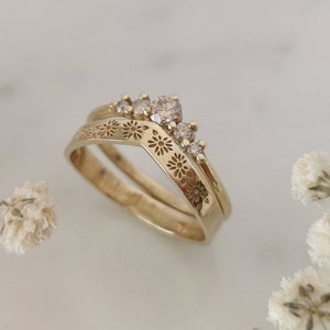 Wedding ring set, 14k flower band paired with a champagne diamond ring.