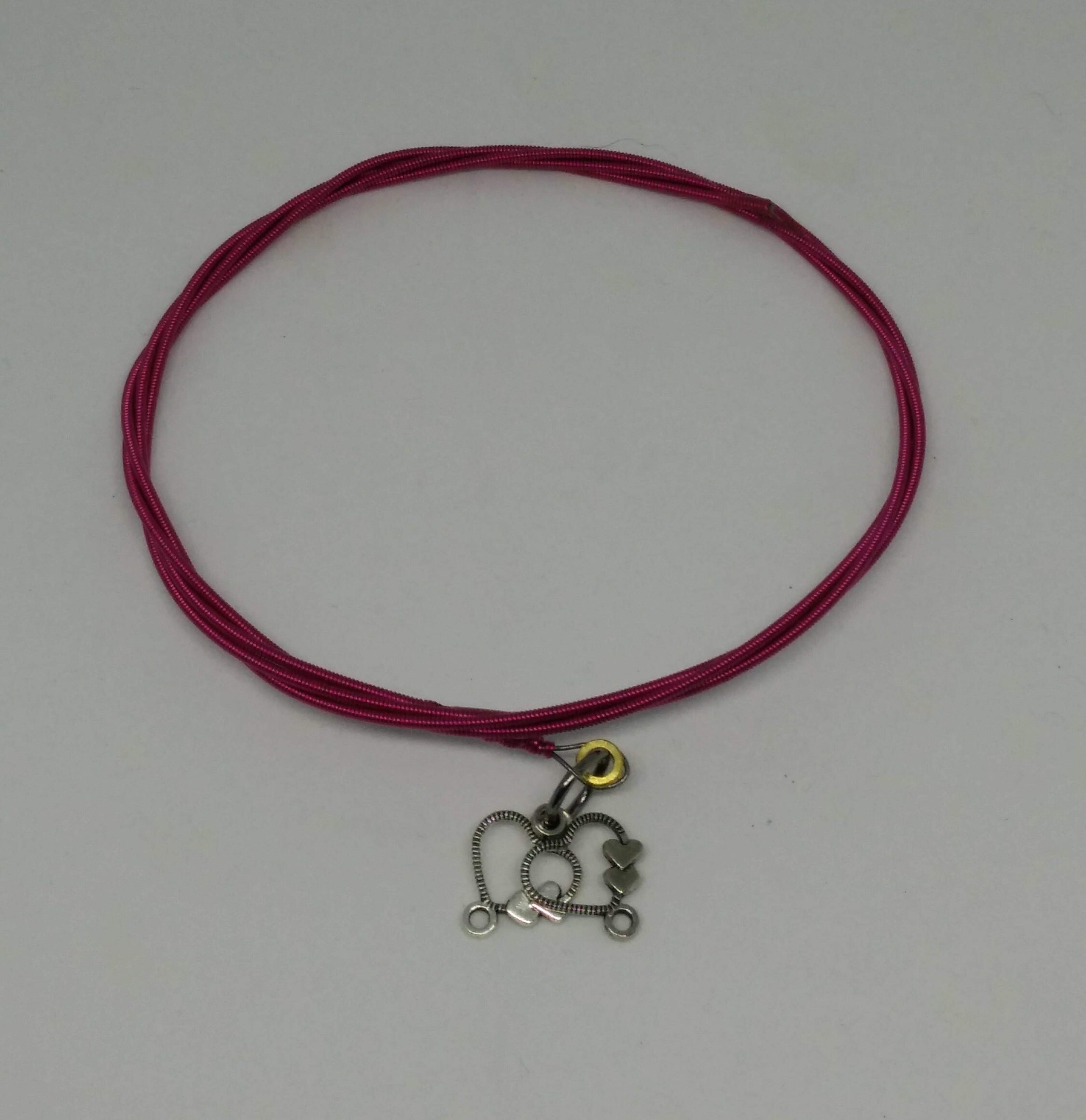 Guitar string steel bracelet with heart detail