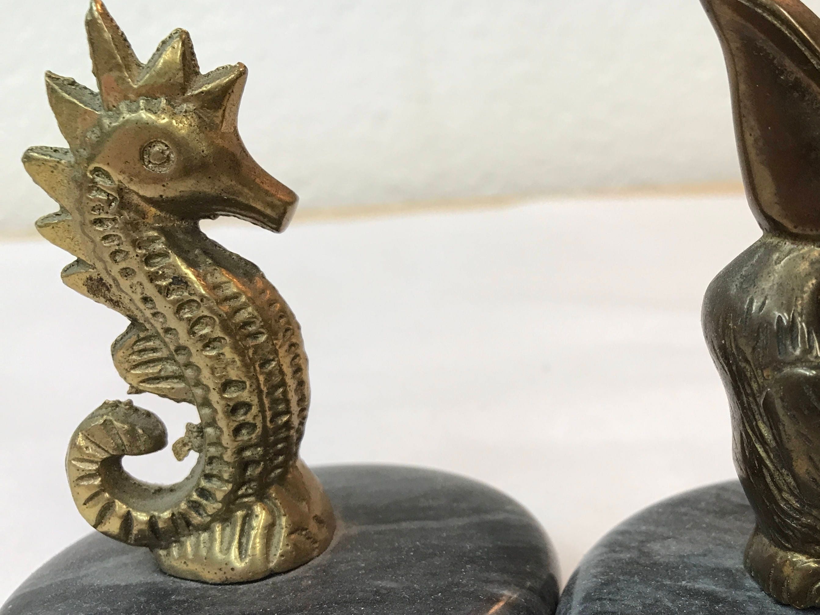 brass marble statues / vintage bookends / seahorse / pelican