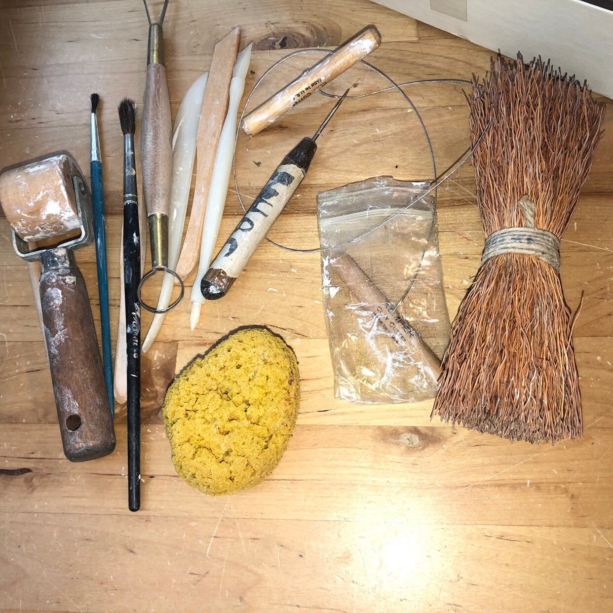 Potter's Tools with handmade blue pottery bowl