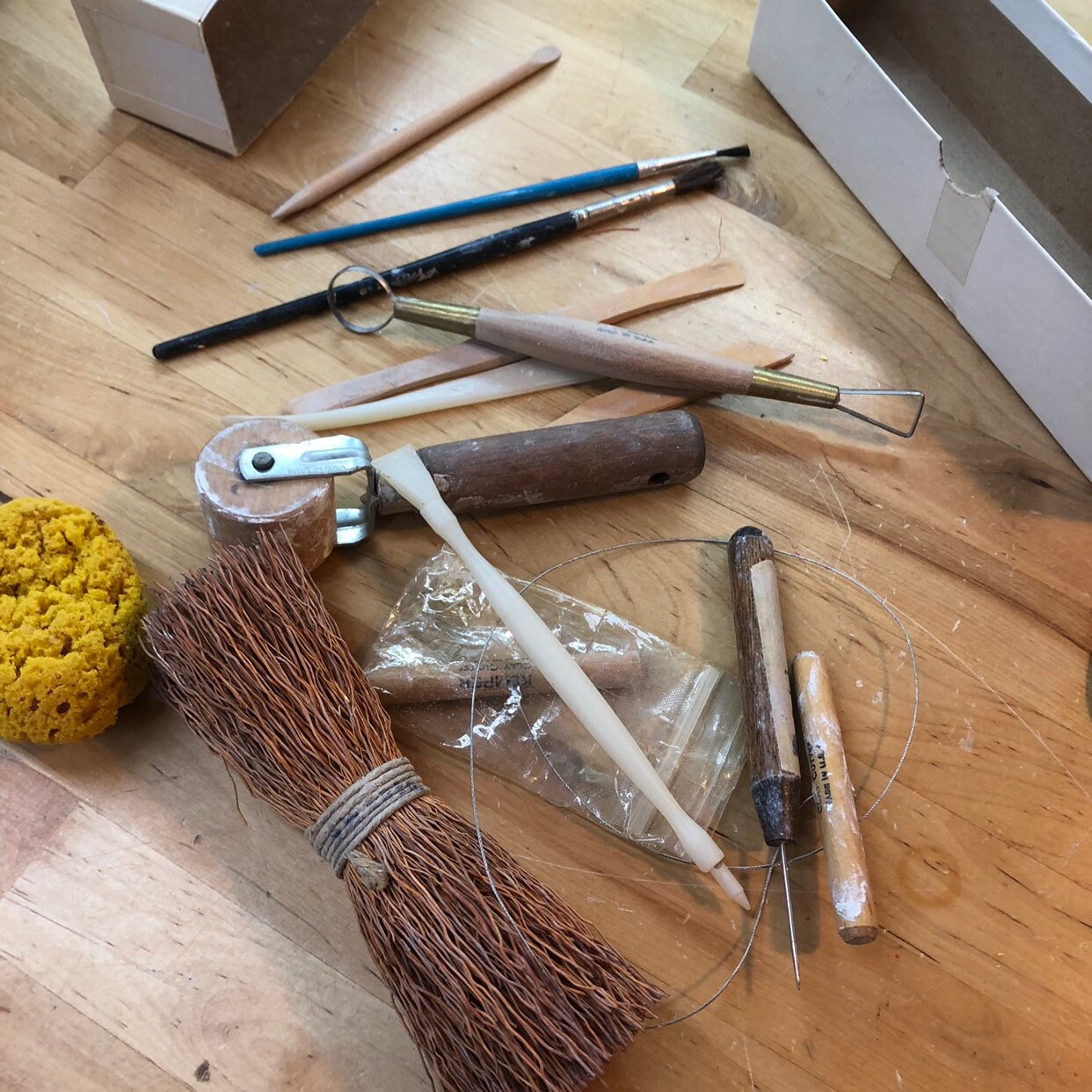 Potter's Tools with handmade blue pottery bowl