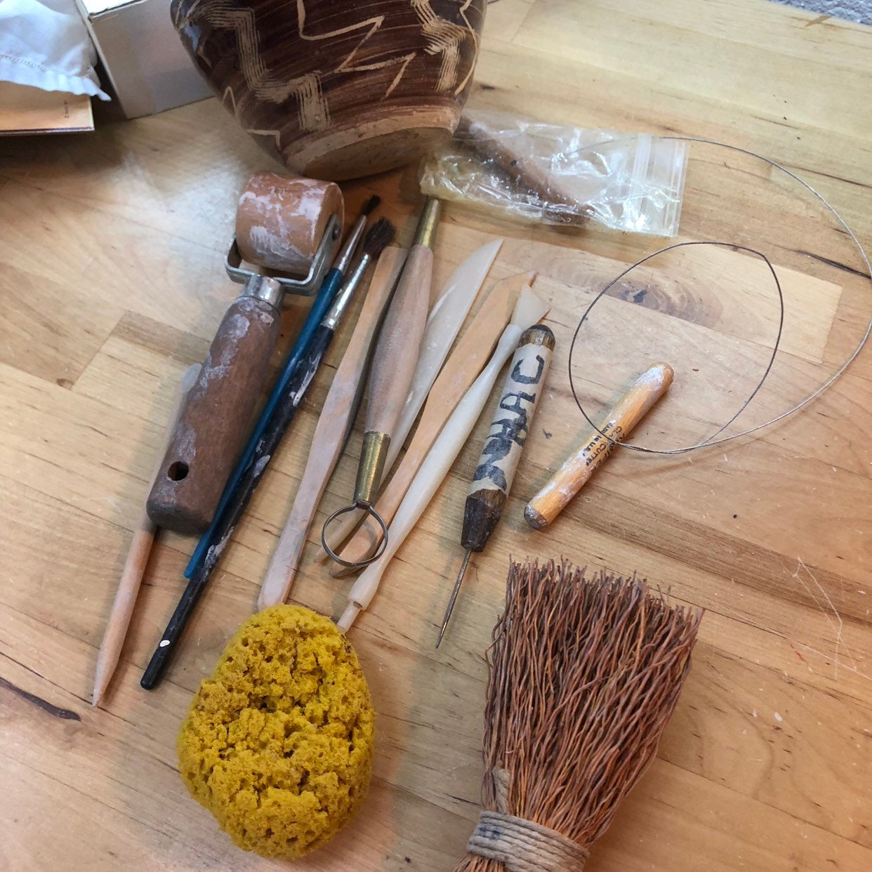 Potter's Tools with handmade blue pottery bowl