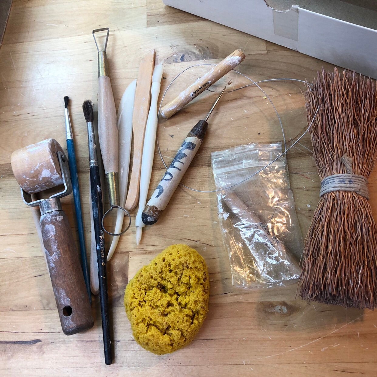 Potter's Tools with handmade blue pottery bowl