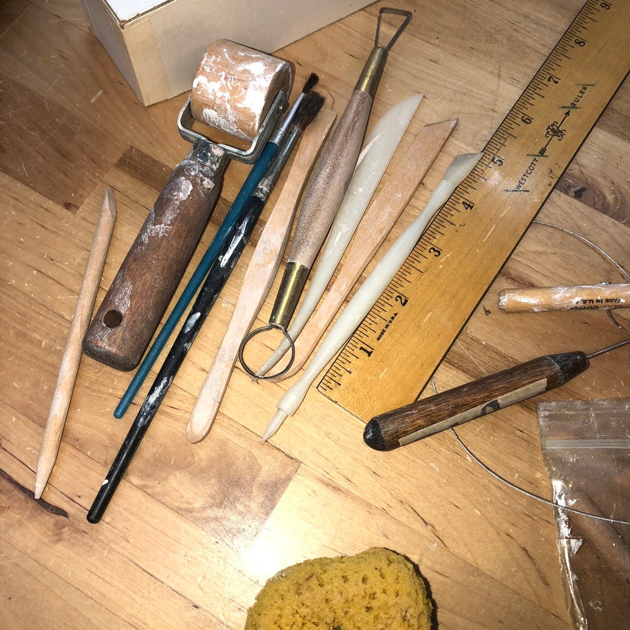 Potter's Tools with handmade blue pottery bowl