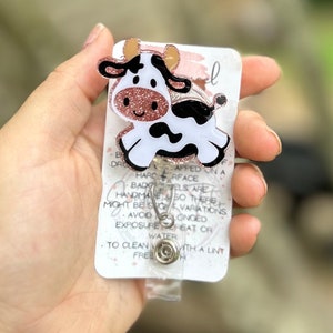 Jumping cow badge reel