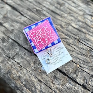 Back & body hurts Badge reel