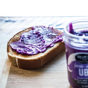 Ube Butter Spread by Wok with Ray. Purple Yam or Ube halaya that is buttery and spreadable.  Great as ube spread or as ube dessert. 16 FL OZ