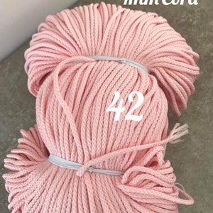 May include: A pink 4mm cotton cord, wound into a ball, with the number 42 written on the side. The cord is 4mm thick and is perfect for crafting projects.