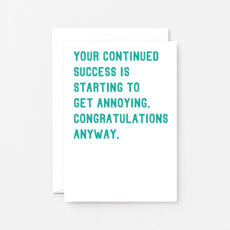 May include: A white card with teal text that reads "Your continued success is starting to get annoying. Congratulations anyway."