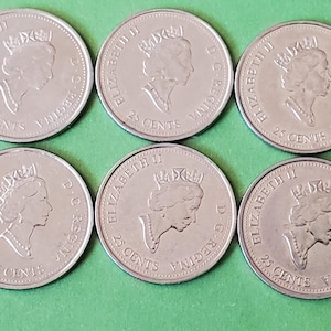 May include: Six silver Canadian 25-cent coins featuring a portrait of Queen Elizabeth II. Each coin has the text "ELIZABETH II D.G. REGINA" and "25 CENTS" around the edge.