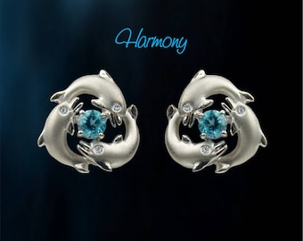 Pendientes de delfín juguetones con ojos de diamante y topacio azul océano