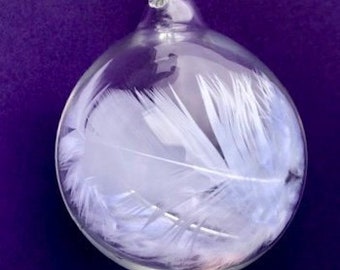 After twin miscarriage, the tender gift of two angel feathers in blown glass with words of comfort, helps soothe a broken heart.