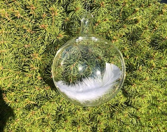 Upon a husbands death, tender words and an Angel feather captured in blown glass to soothe a wifes aching grieving heart.