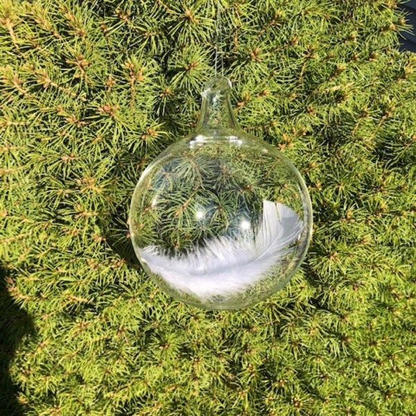 Upon a husbands death, tender words and an Angel feather captured in blown glass to soothe a wifes aching grieving heart.