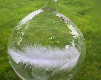 Upon a mother's death, tender words and an Angel feather captured in blown glass to soothe a grieving broken heart.