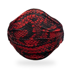 May include: A red and black face mask with a snake skin pattern.