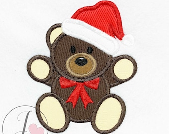 May include: A brown teddy bear wearing a red and white Santa hat with a red bow. The bear is sitting with its arms outstretched.