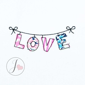 May include: A banner with the word "LOVE" spelled out in colorful fabric letters. Each letter is attached to a string with a bow at each end.