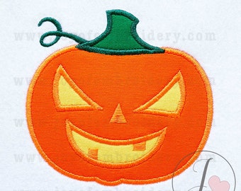 May include: An orange and green embroidered pumpkin with a scary face. The pumpkin has a wide, toothy grin and glowing yellow eyes.
