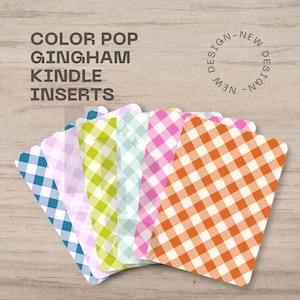 May include: A set of rectangular Kindle inserts featuring a variety of colorful gingham patterns in blue, light purple, lime green, mint, pink, and orange. The text COLOR POP GINGHAM KINDLE INSERTS and NEW DESIGN NEW DESIGN are printed above.