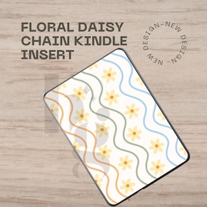 May include: Kindle insert with a floral daisy chain design. The insert features a white background with yellow daisy flowers, wavy lines in orange, green, and blue, and the text "FLORAL DAISY CHAIN KINDLE INSERT". The words "NEW DESIGN" are also visible.