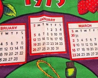 1975 vintage tea towel with calendar and bright fruits and wine detail, kitchen collectable dish cloth