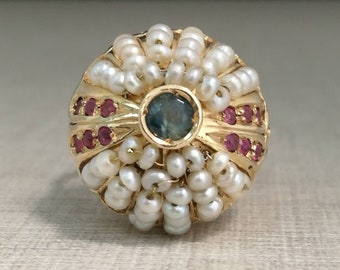 Vintage 12kt Gold Ring with sapphire, rubies and pearls.