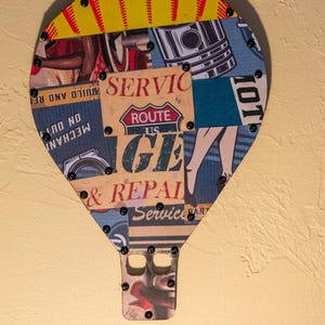 hot air balloon metal sculpture made from hand cut tin signs.