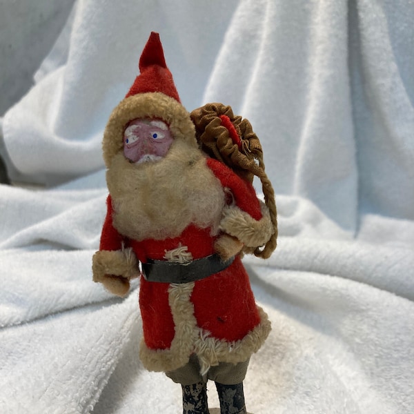 Antique Father Christmas Belsnickle Putz Santa, holding onto a pack on his back, black belt