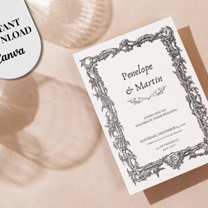 May include: A white wedding invitation card featuring a black ornate baroque-style frame border. The text reads Penelope & Martin, invite you to celebrate their wedding, Saturday, December 15, 2026, three o'clock in the afternoon, 123 anywhere st., any city.