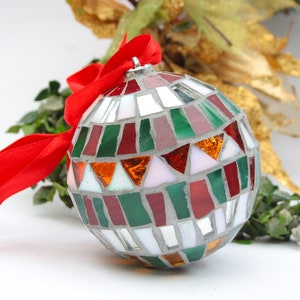 Christmas balls decorated by hand in Italy. Artistic glass mosaic Christmas balls. Christmas ornament in mosaic. Mix rosso