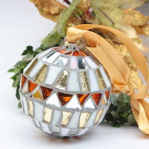 Christmas balls decorated by hand in Italy. Artistic glass mosaic Christmas balls. Christmas ornament in mosaic. White