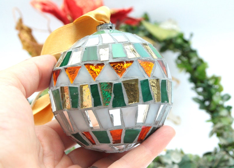 Christmas balls decorated by hand in Italy. Artistic glass mosaic Christmas balls. Christmas ornament in mosaic. Mix verde