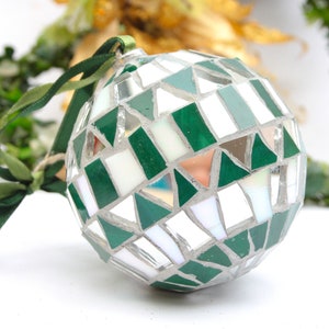 Christmas balls decorated by hand in Italy. Artistic glass mosaic Christmas balls. Christmas ornament in mosaic. Green