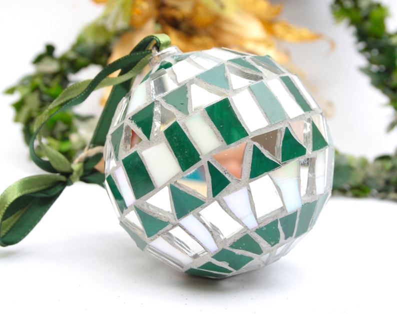 Christmas balls decorated by hand in Italy. Artistic glass mosaic Christmas balls. Christmas ornament in mosaic. Green