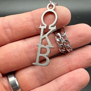 Screen Accurate v2 Scream 2 Sidney OKB Greek Letters Necklace Prop Replica Ghostface