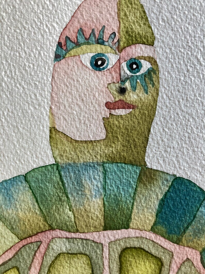 K&ouml;nnte beinhalten: Aquarellmalerei eines stilisierten Gesichts in Gr&uuml;n, Blau und Rosa. Das Gesicht ist teilweise von einer gr&uuml;n, blau und gelb gemusterten Schale verdeckt.