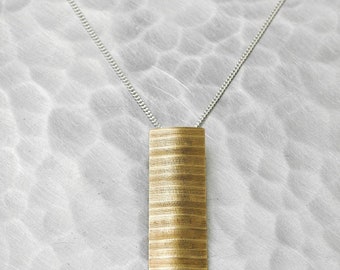 Colgante reciclado de platillo de bronce y plata de ley