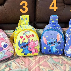May include: Six colorful, small, character-themed backpacks with adjustable straps. The backpacks feature Stitch from Lilo & Stitch, with different designs and colors, including pink, blue, yellow, and purple.