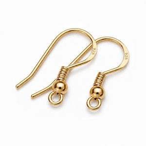 May include: A pair of gold-toned earring hooks featuring a curved wire design, a coiled spring detail, and a small spherical bead above a circular loop. Each hook is stamped with the number 925, indicating sterling silver base metal construction.