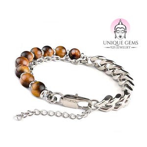 Puede incluir: Un brazalete de cadena de plata con cuentas de ojo de tigre marrón. El brazalete tiene un cierre de langosta y una pequeña cadena de extensión. El brazalete está hecho de plata de ley 925.