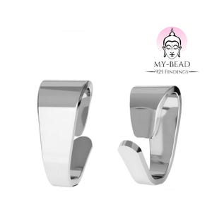 May include: Two silver-toned metal pendant bails, each with a flat, rectangular shape and a curved hook. The bails are designed to attach a pendant to a chain or cord.