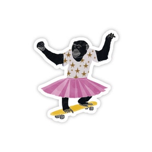 May include: A black chimpanzee wearing a pink tutu and a white shirt with gold stars is skateboarding on a yellow skateboard.