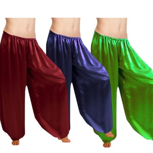 May include: Three pairs of wide-leg, flowing pants in burgundy, navy blue, and bright green. The pants are made of a shiny, satin-like fabric.