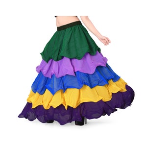 May include: A multi-layered skirt with a ruffled hem. The skirt is green, purple, blue, yellow, and purple. The skirt is made of a lightweight fabric and is perfect for dancing or twirling.