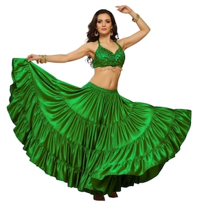 May include: A vibrant green belly dance costume. The set includes a halter top with sequin embellishments and a flowing, tiered skirt. The skirt is made of a shiny, satin-like fabric. The costume is designed for dance performances.