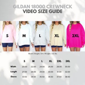 Pode incluir: Guia de tamanhos em v&iacute;deo para moletom Gildan 18000 com cinco modelos de manga comprida nos tamanhos S, M, L, XL e 2XL. Uma tabela lista medidas de largura, comprimento e manga em polegadas para tamanhos S a 3XL, modelo 5'8" e 145 lbs.