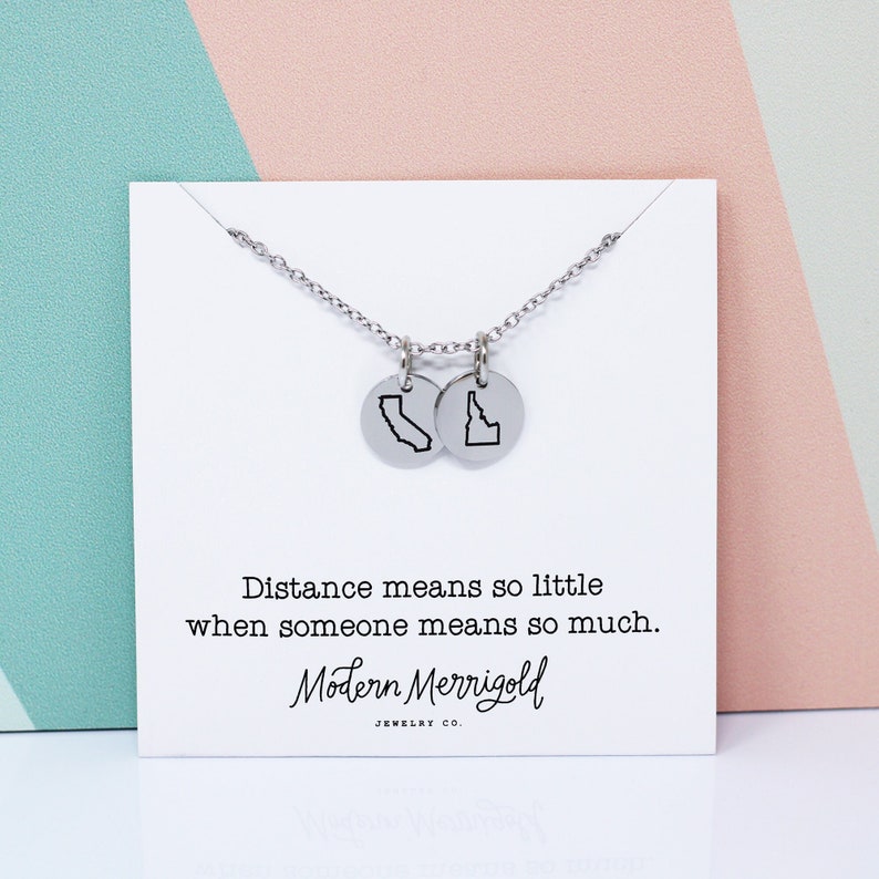 state charm necklace in silver on distance jewelry card